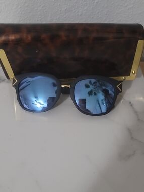 Tory Burch Black Frame Sunglasses with Blue Mirrored Lenses
